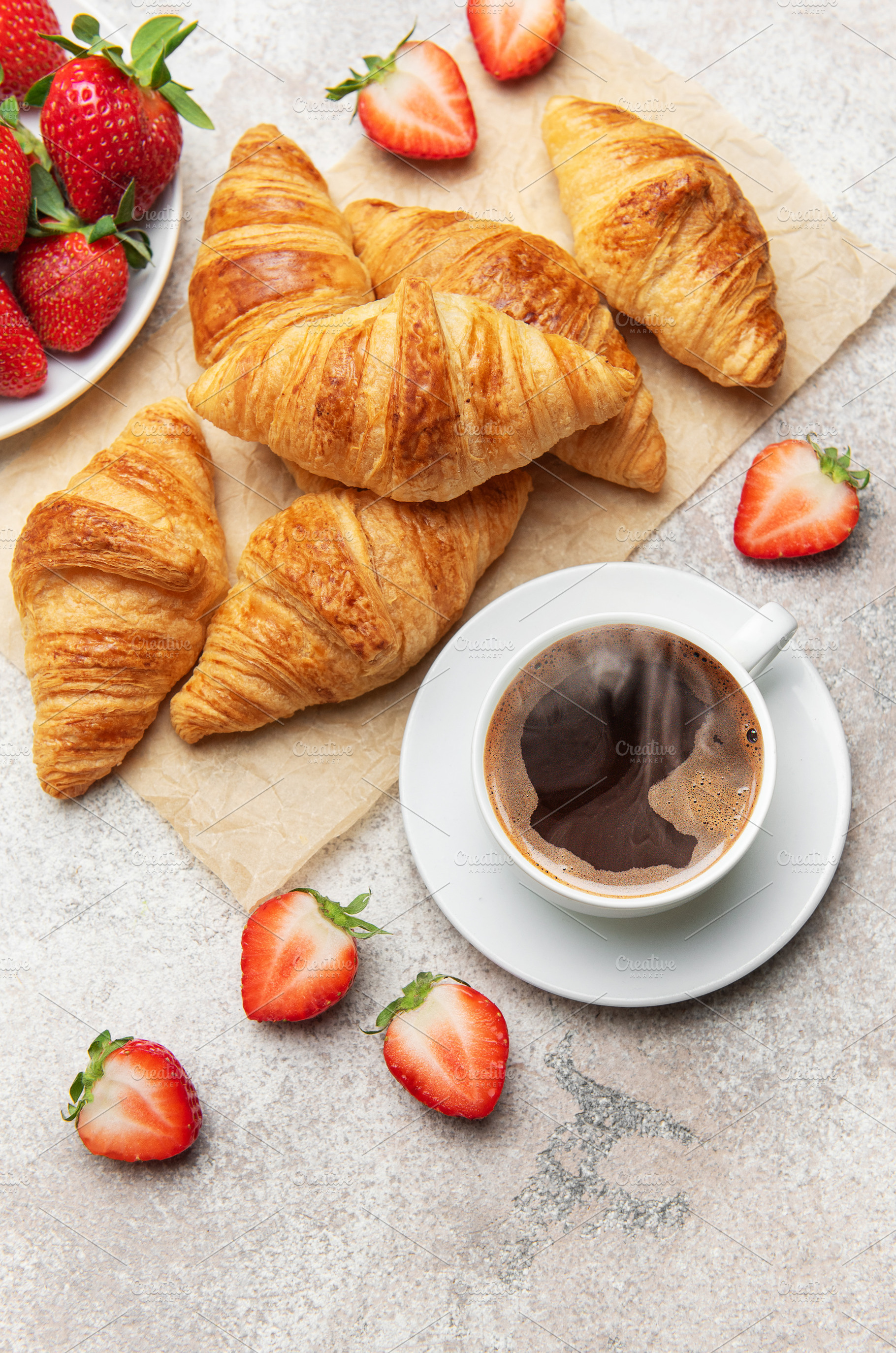 Delicious french breakfast with croissants, coffee and strawberr, a Food & Drink Photo by Olena Rudo