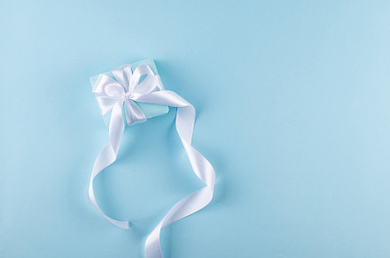Christmas blue background. Holidays gift box wrapped in blue pap, a Holiday Photo by vimart