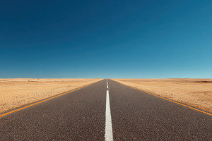 Long road stretching into clear sky, a Photo by Beautiful things