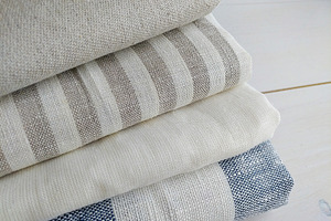 Pile of fabrics containing color, detail, and closeup