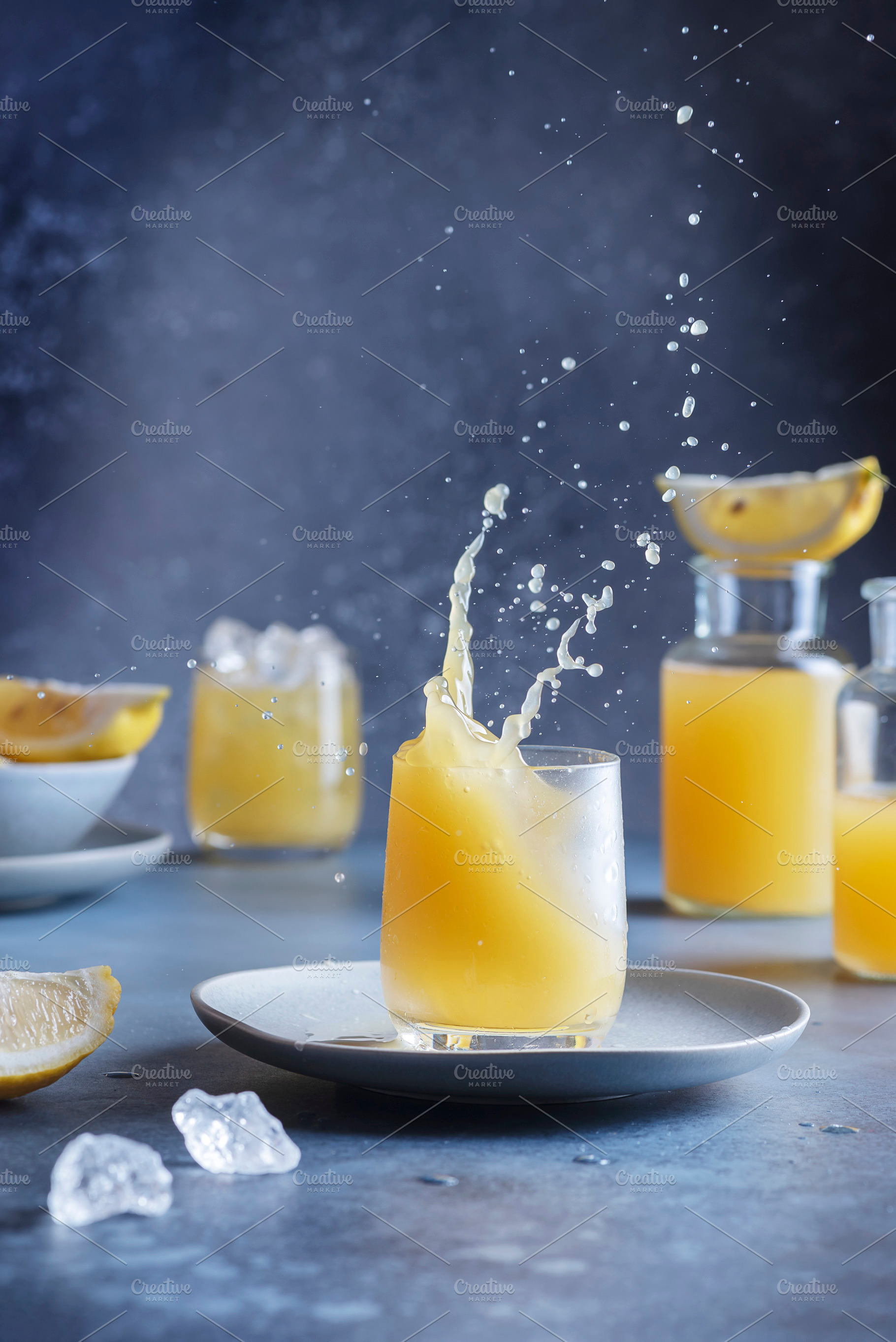 A splash of a lemon cocktail, a Food & Drink Photo by oxana.denezhkina