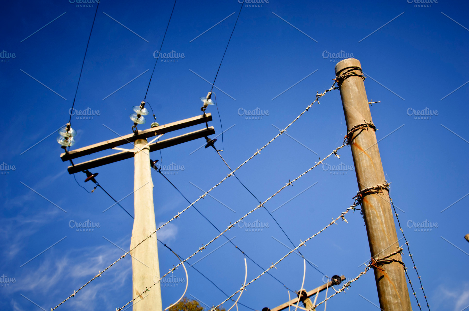 Barbed Wire Power Line, an Industrial Photo by THP Creative
