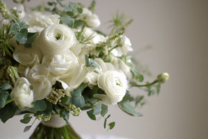 Elegant bouquet featuring white ranunculus, roses, and fresh euc, a Photo by Studio ANNA
