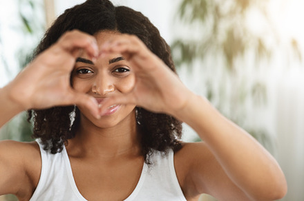 I Love Myself. Happy Woman Showing H, a Background Photo by Prostock-Studio