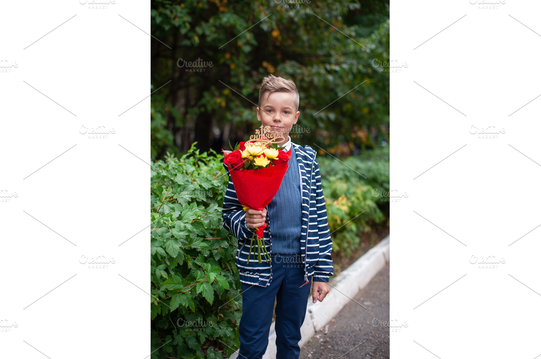 Young Pupil Boy Holding a Bouquet, a School & Education Photo by Jan Jack Russo Media