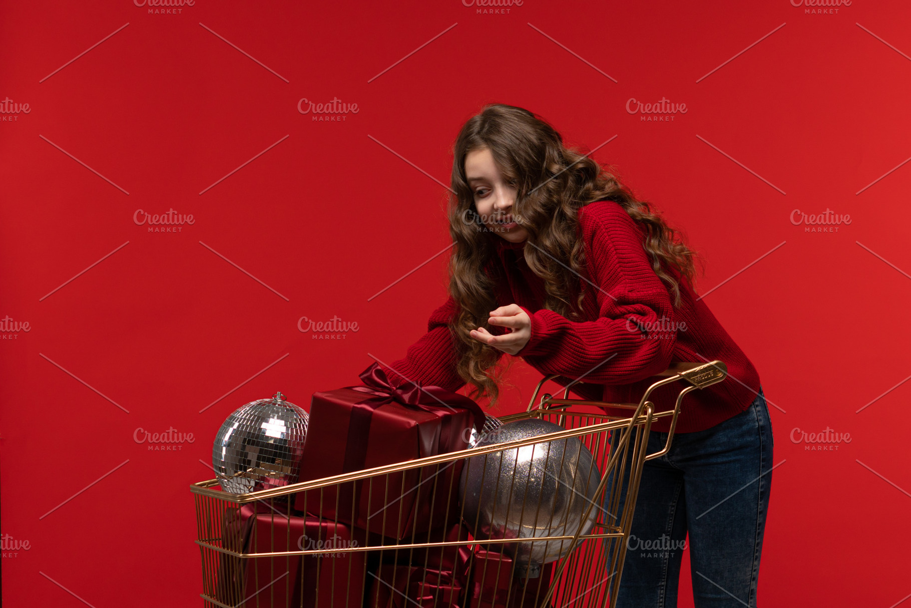 Young girl in red sweater, a Holiday Photo by Elena Vagengeim