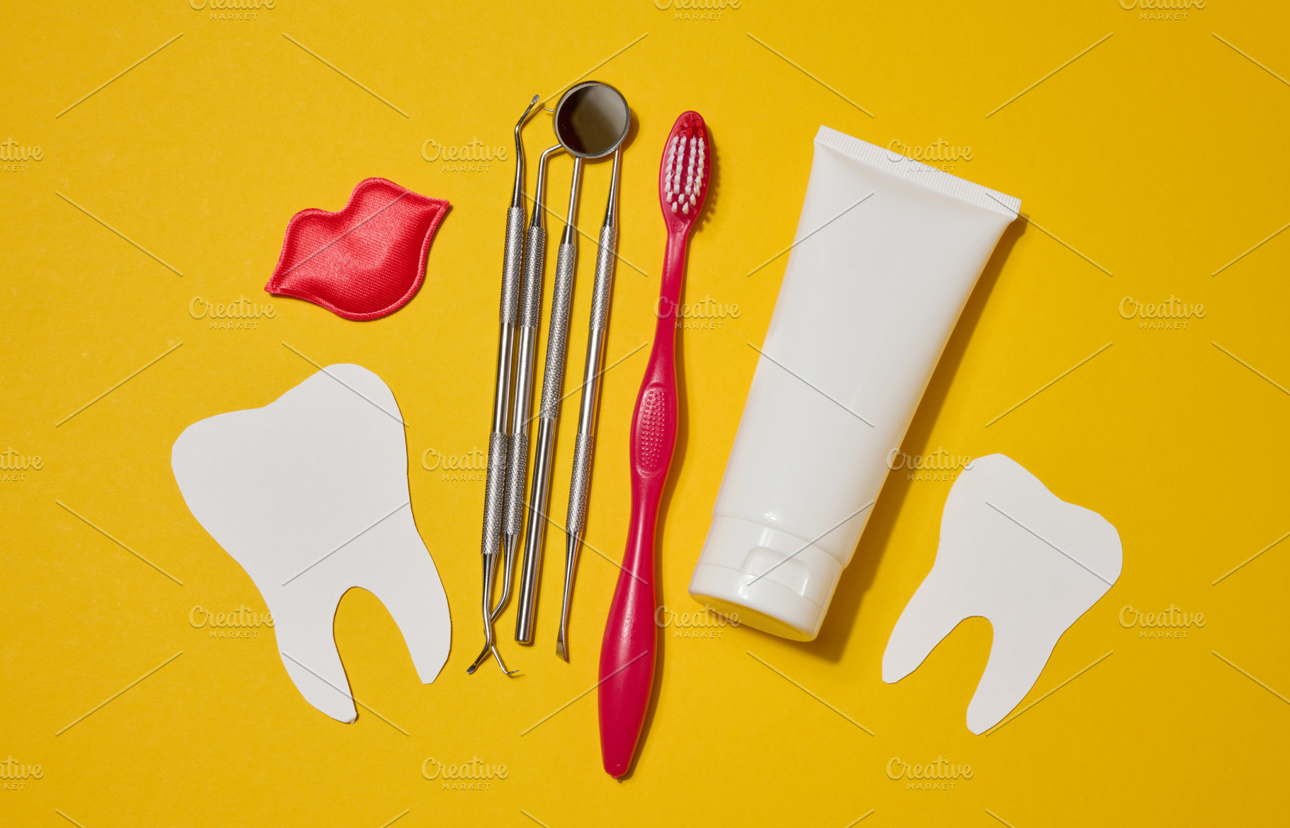 Red toothbrush, white tube of toothpaste, red decorative lips, d, a Health & Medical Photo by ndanko
