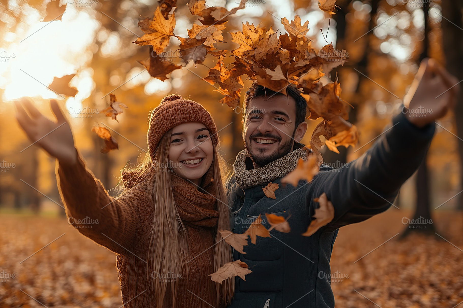 Young couple throw up the autumn leaves in the park, a Person Photo by AlyaAnd