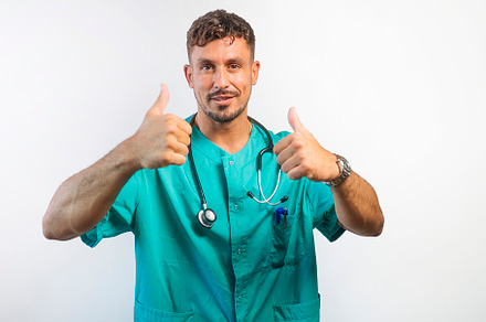 Smiling Doctor Giving Two Thumbs Up