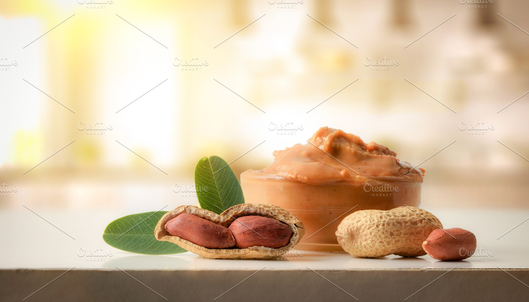 Freshly sliced bread spread with peanut butter on wooden t, a Food & Drink Photo by Davizro's Market
