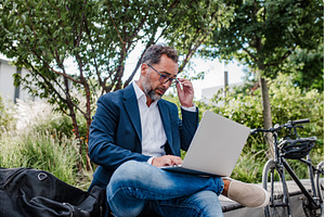 Manager working in urban park, a Business Photo by HalfPoint