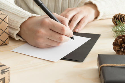 Woman writing a christmas card, JPEG