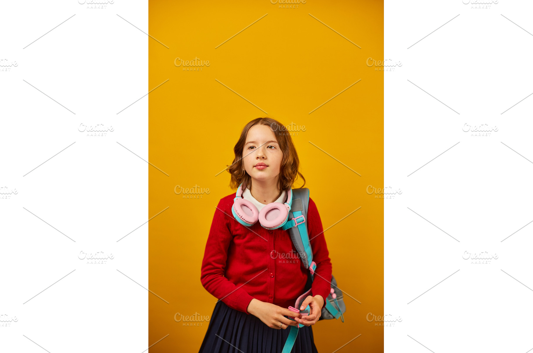 Young girl with headphones and a, a School & Education Photo by IlliaBondarPhotography