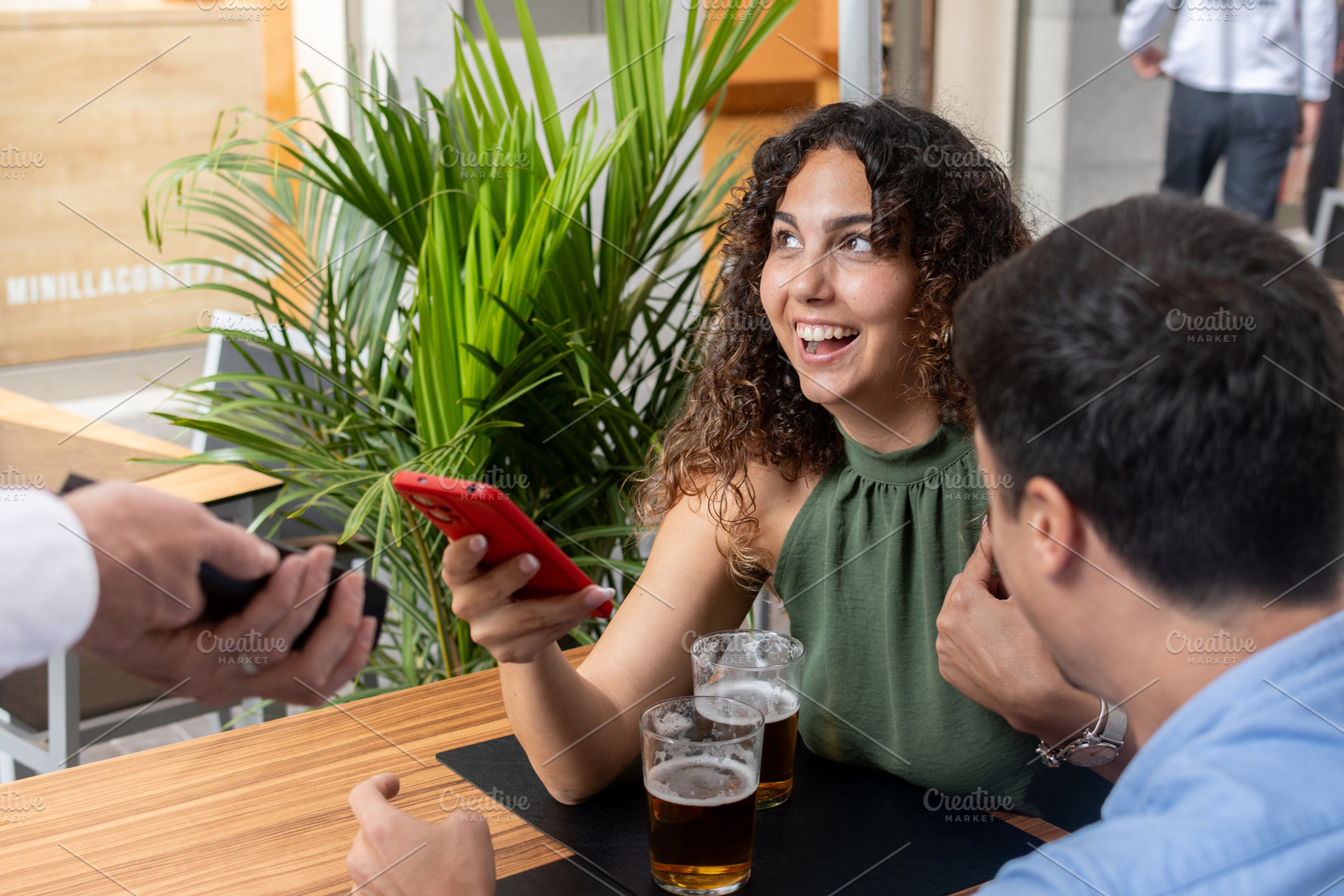 Woman Paying the Bill with Smartphone at a Restaurant, a Person Photo by etorres69