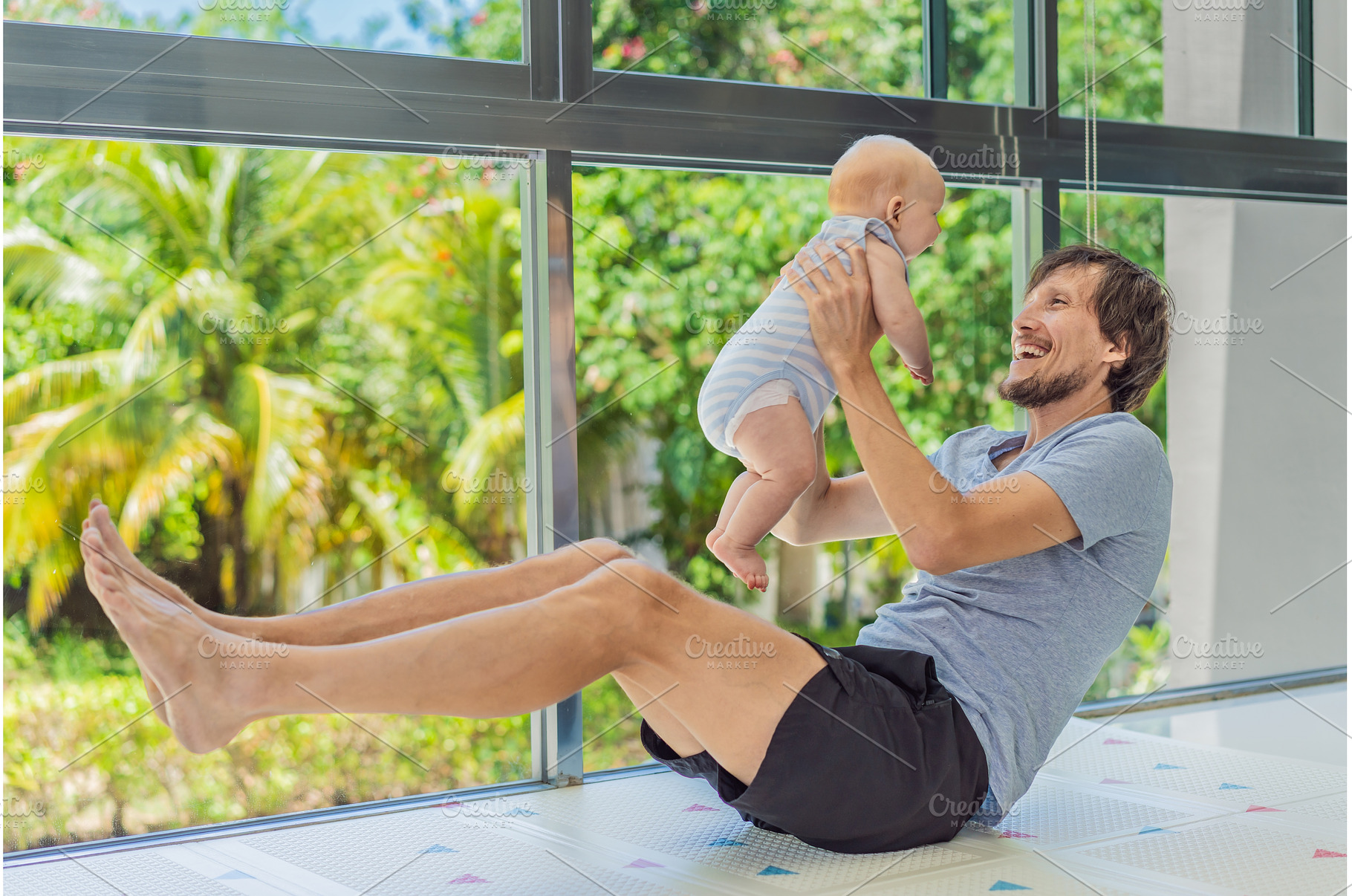 Father exercising with his small, a Sports & Recreation Photo by Elizaveta Galitskaya