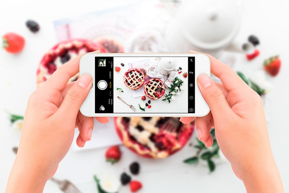Hands holding iPhone 7 Mockups (New), an iPhone Mockup by Uidea (Photo 3 of 4)