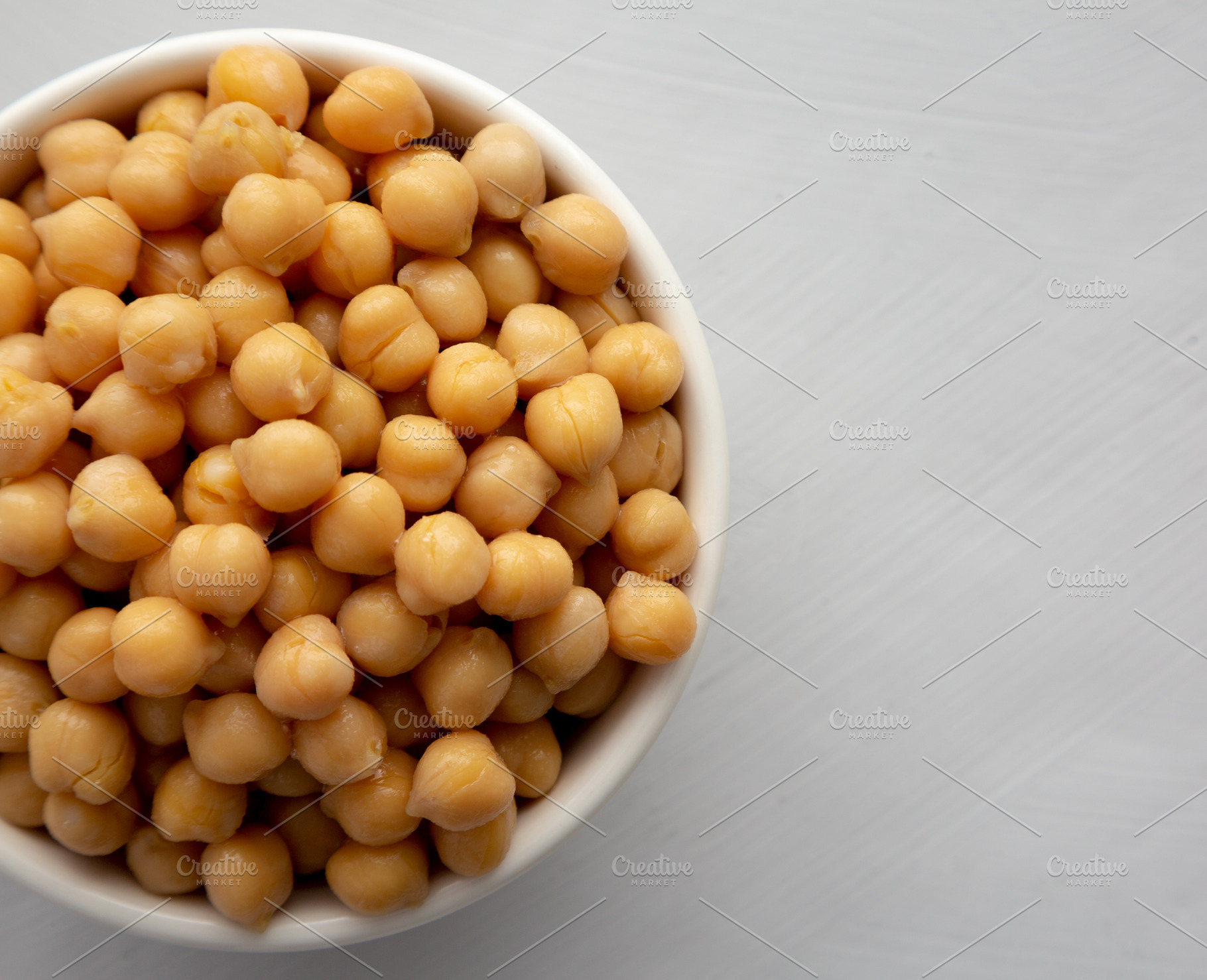 Homemade Preserved Chickpeas in a Bowl, top view. Copy space., a Food & Drink Photo by LiudmylaChuhunova