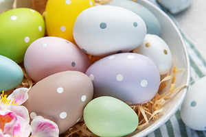 Colorful easter eggs with polka dots in a bowl, a Holiday Photo by Olena Rudo