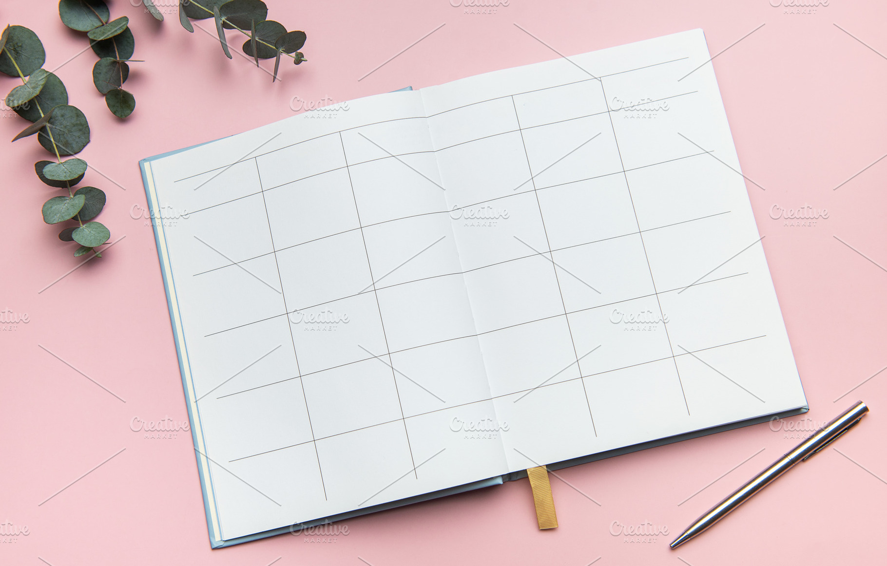 Open notebook showing blank pages with pen and eucalyptus leaves, a Business Photo by Olena Rudo