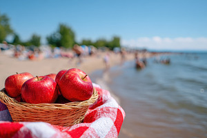 Basket of apples at the beach on a sunny day, a Food & Drink Photo by AlyaAnd