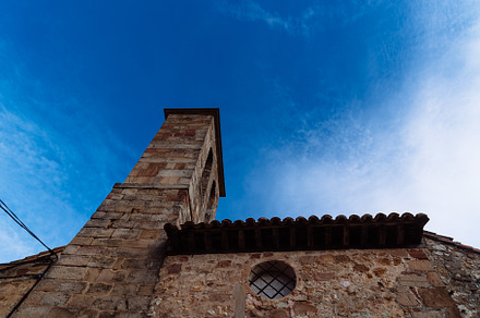Bell tower of a medieval stone church in the historic town of Atienza, an Architecture Photo by Architect´s eye