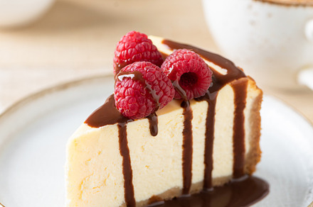 Slice of cheesecake with chocolate, a Food & Drink Photo by The baking man