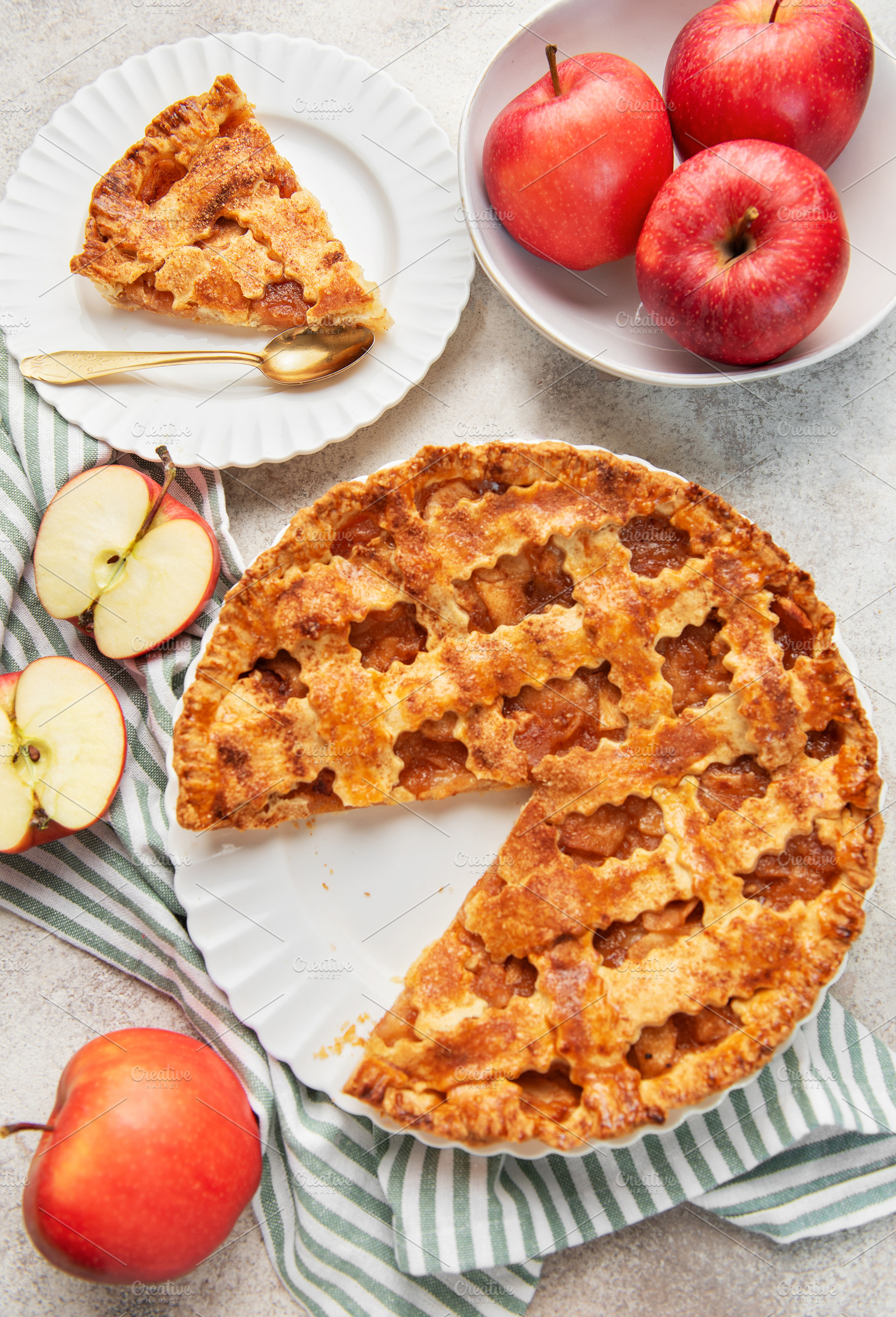 Homemade apple pie with a slice and fresh apples, a Food & Drink Photo by Olena Rudo