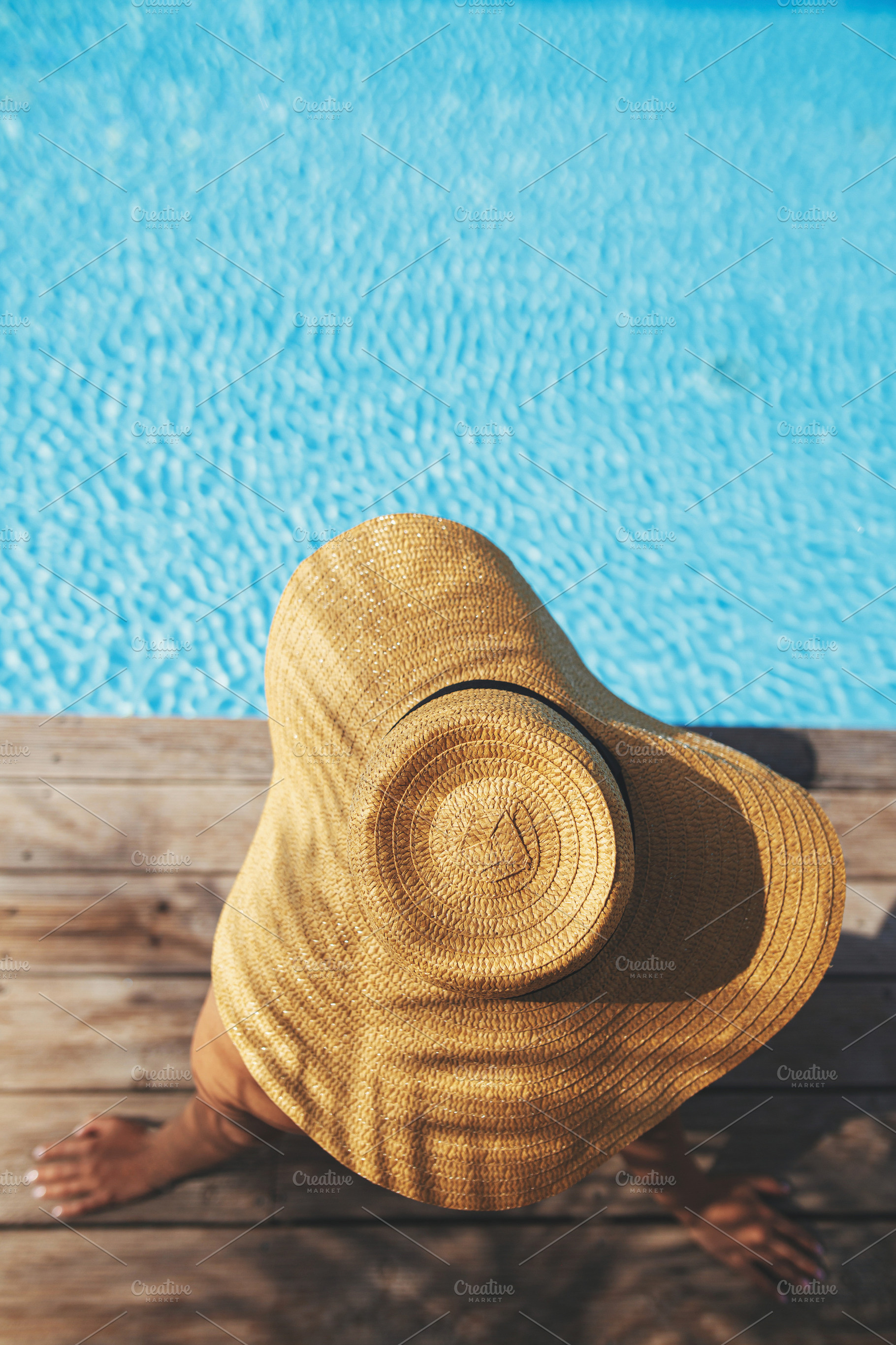 Enjoying summer vacation. Woman in hat relaxing on wooden pier u, a Person Photo by Sonjachni