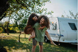 Young couple is on a camping trip in, a Person Photo by HalfPoint