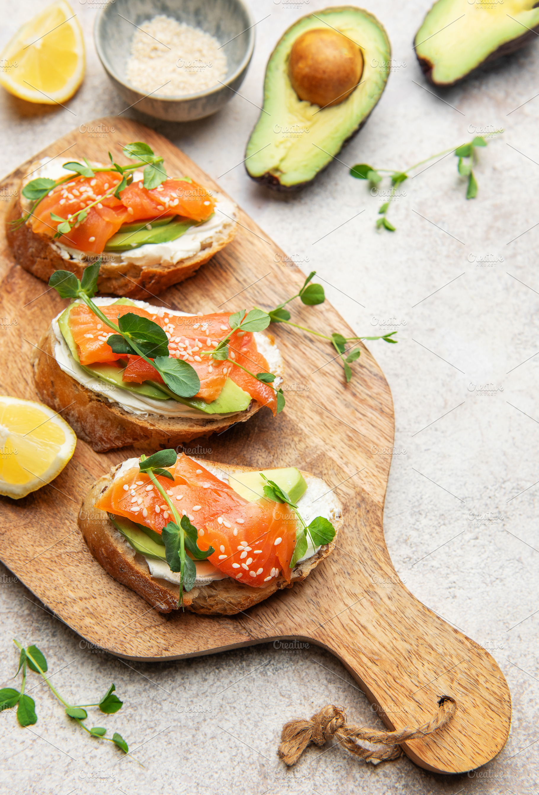 Salmon avocado bruschetta with cream cheese and greens, a Food & Drink Photo by Olena Rudo