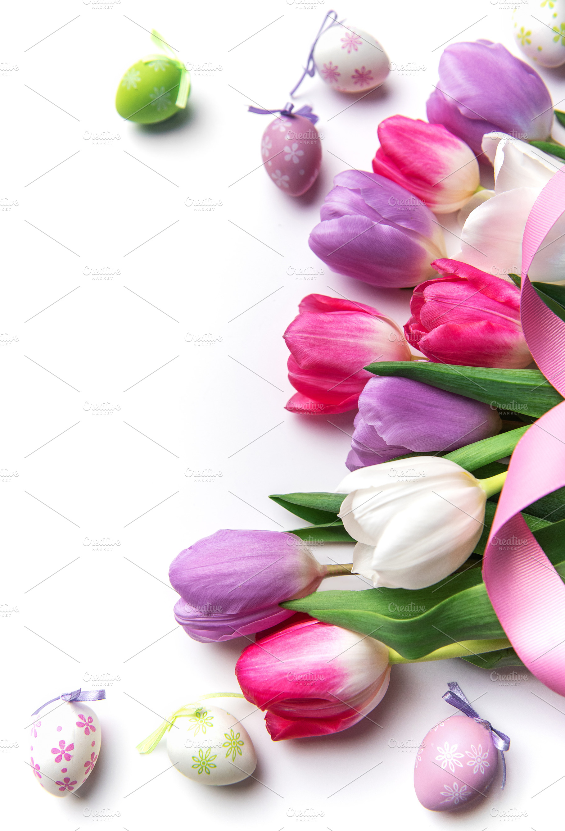 Easter spring tulips with decorative eggs and pink ribbon, a Holiday Photo by Olena Rudo