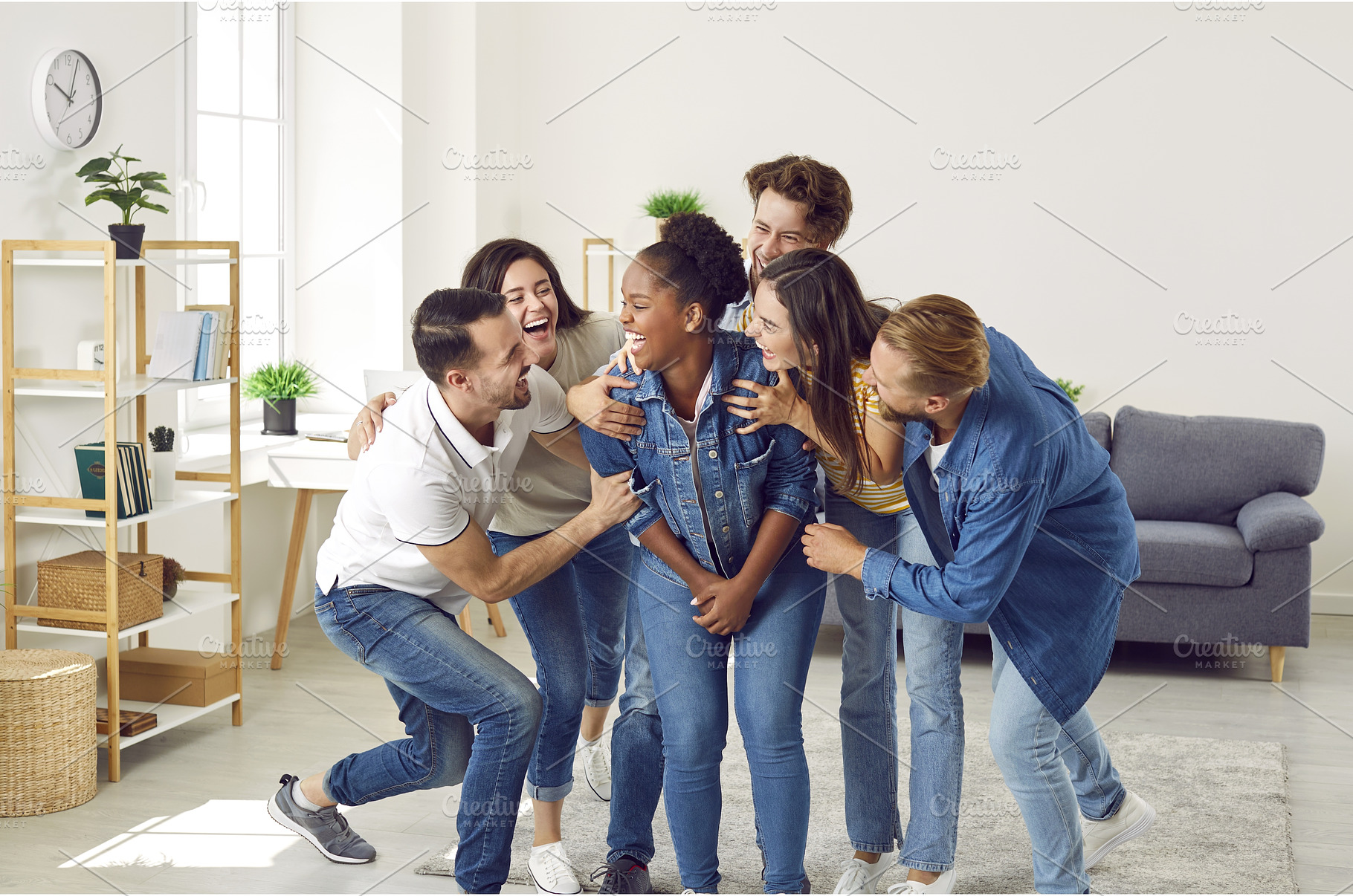 Happy young people laughing at a, a Person Photo by StudioRomantic