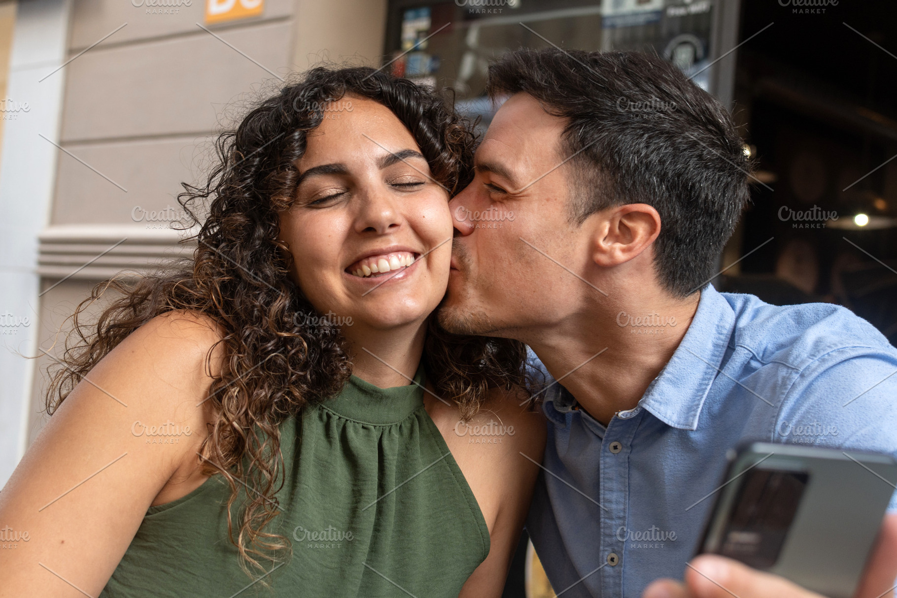 Happy Young Man Kissing His Girlfriend, a Person Photo by etorres69
