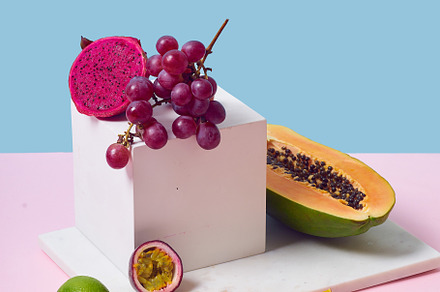 Tropical fruits variety on a colorful background. Side view with
