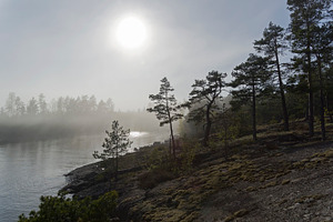 Fog over the ladoga lake containing fog, haze, and mist