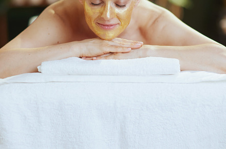 relaxed 40 years old woman in spa salon laying on massage table, a Health & Medical Photo by Alliance Images