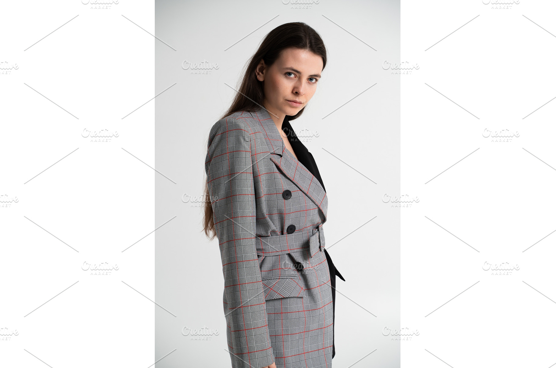 Young brunette woman posing in a, a Business Photo by volodymyrshtun13795