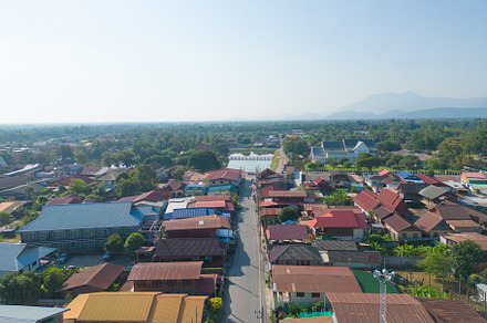 Aerial view of local residential neighborhood roofs. Urban housi