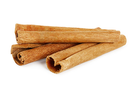 Three cinnamon sticks isolated on wh featuring cinnamon, stick, and isolated