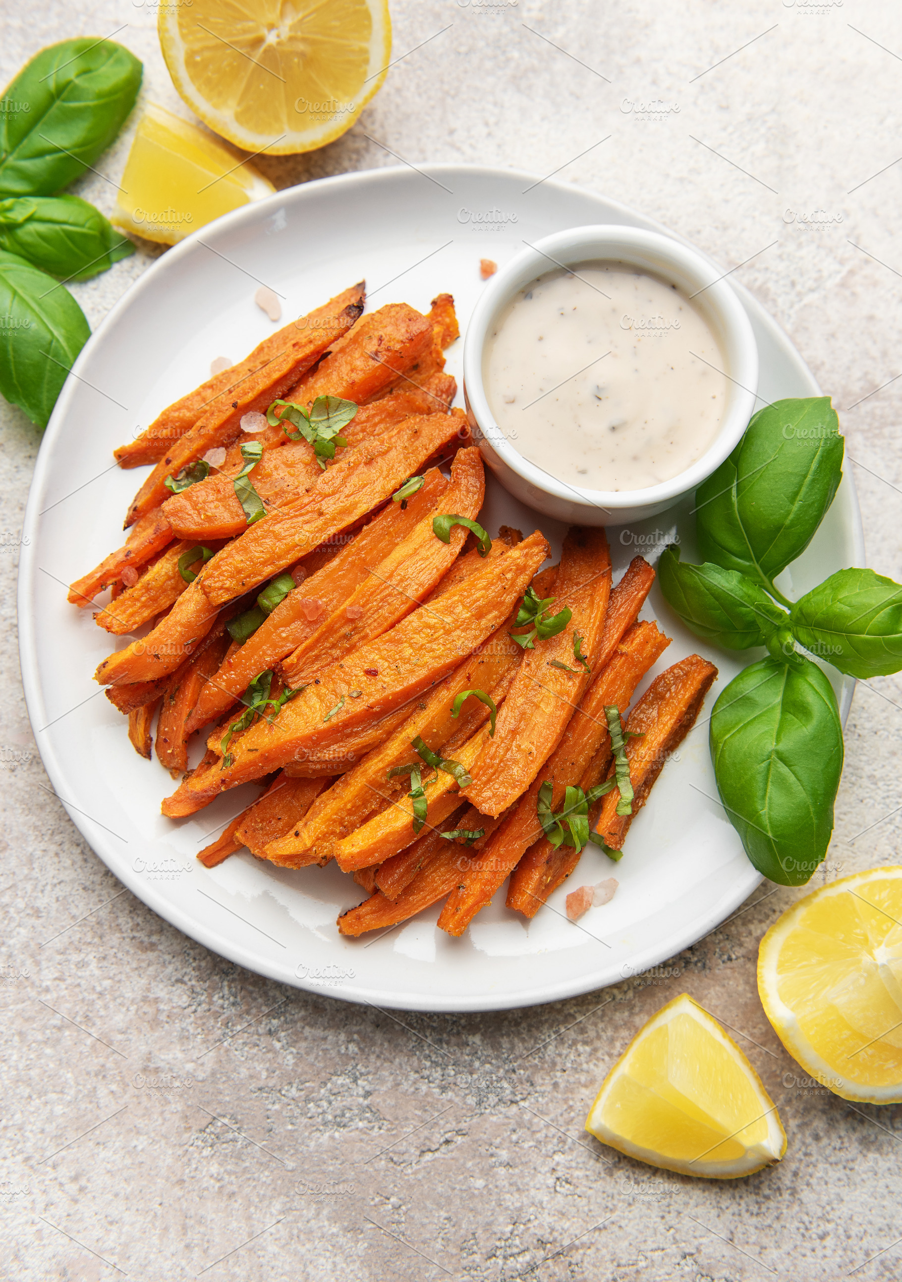 Sweet potato fries with dipping sauce and lemon, a Food & Drink Photo by Olena Rudo