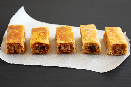 Homemade Baklavas with Honey, Chocolate and Almond on a black ba, a Food & Drink Photo by LiudmylaChuhunova