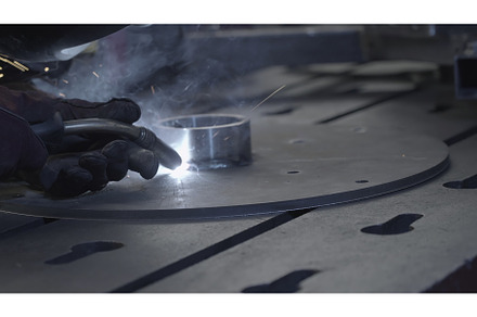 Welder in gloves holds welding with, an Industrial Photo by Media Whale Stock