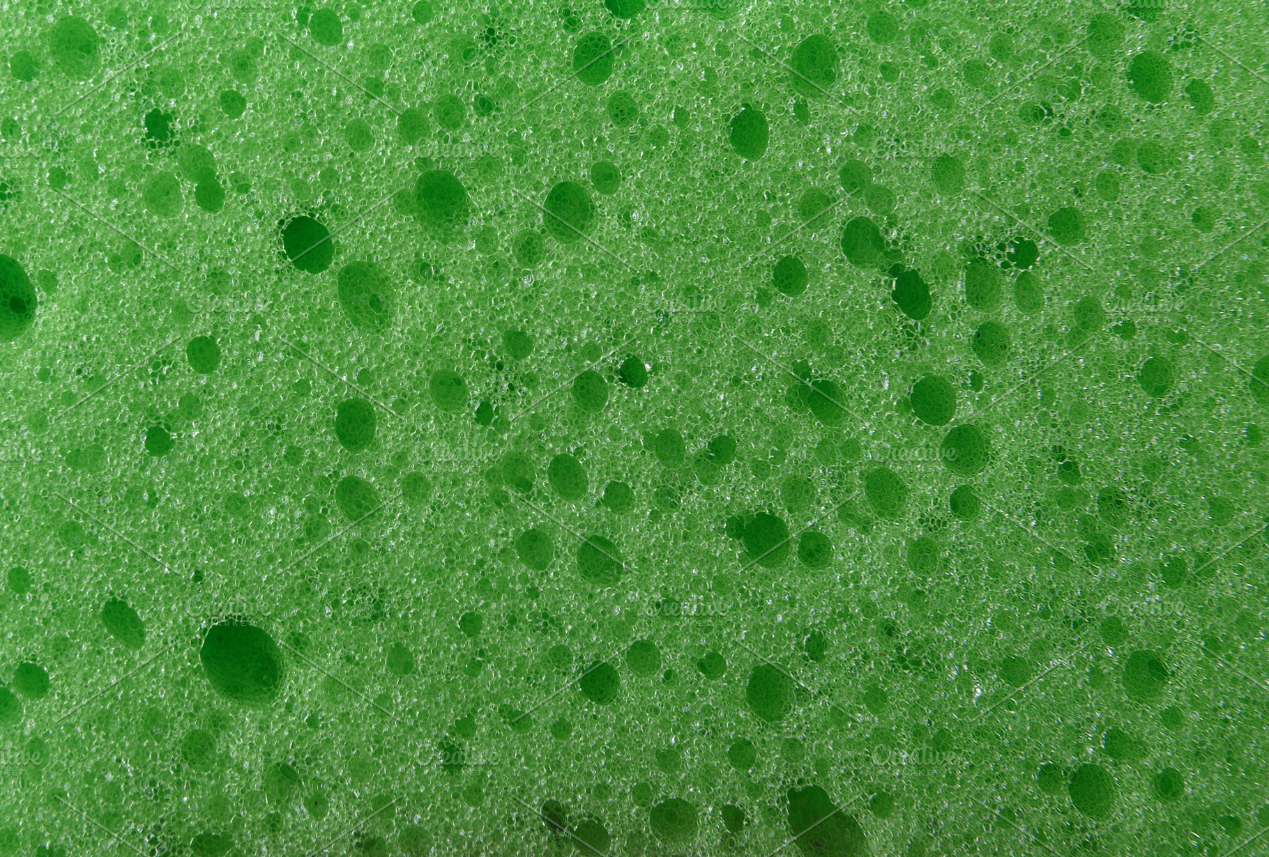 Detail of texture of synthetic green sponge with many holes, an Abstract Photo by Davizro's Market