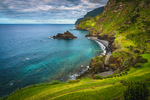 Seaside view with colorful rocks, a Nature Photo by Alpine Dreams