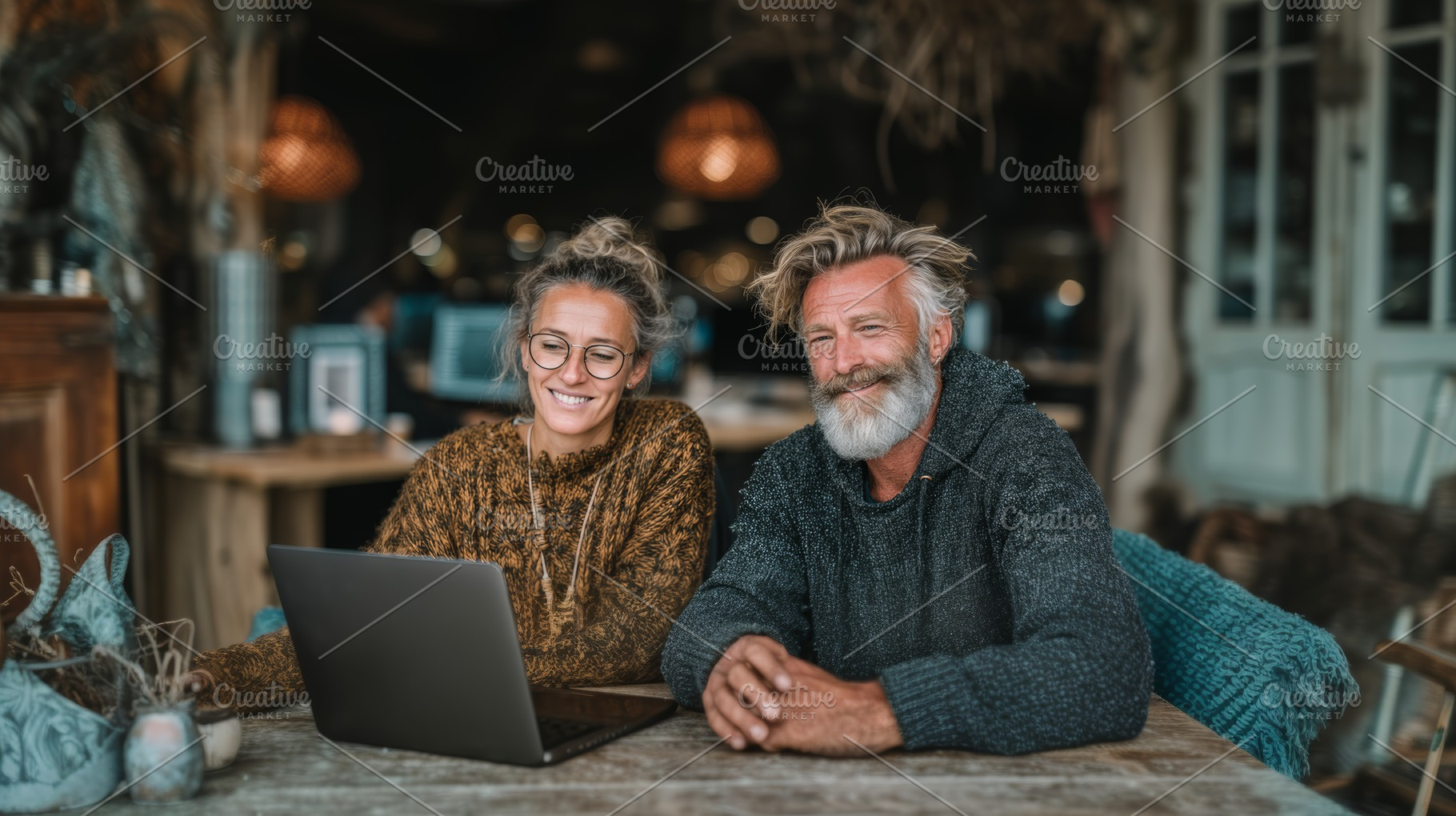 Two smiling professionals collaborating together on a laptop in a cozy workspac, a Business Photo by AS photostudio