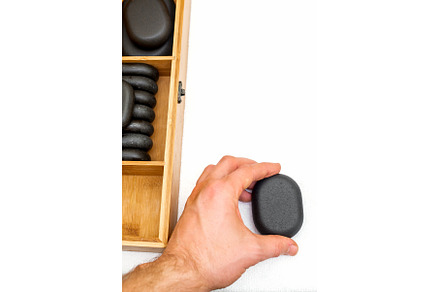 Hot stones for massage in a wooden, a Health & Medical Photo by okskukuruza