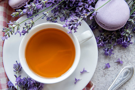 Cup of tea with macaroon dessert with lavender flavor, a Food & Drink Photo by Olena Rudo