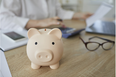Close up of piggy bank on desk in