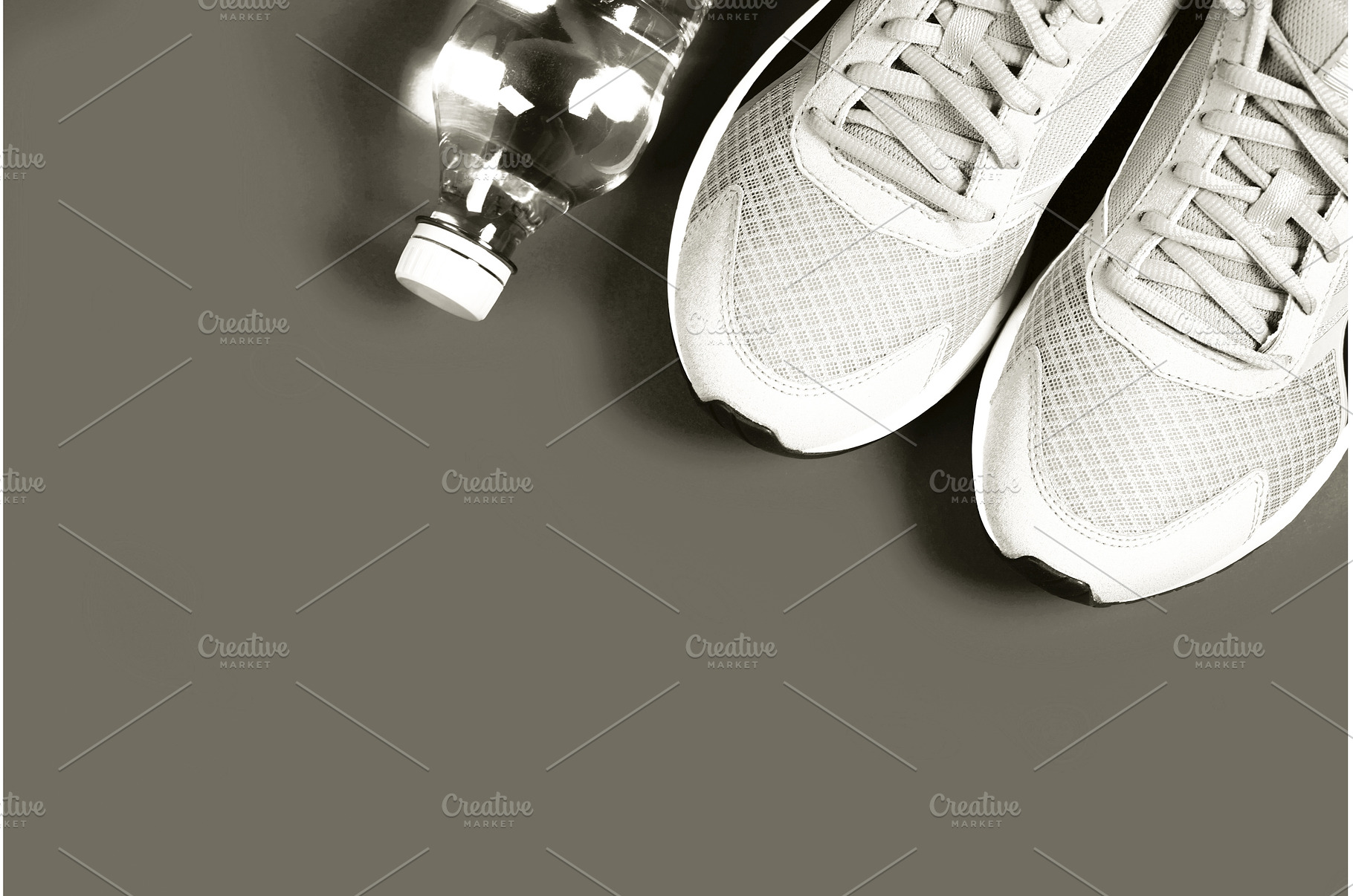 Running shoes and water bottle for, a Sports & Recreation Photo by Anna Efetova
