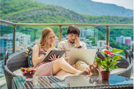 Man and woman working on the terrace, a Person Photo by Elizaveta Galitskaya